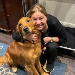 Our Head of Housekeeping Lourdes with one of our dog guests.