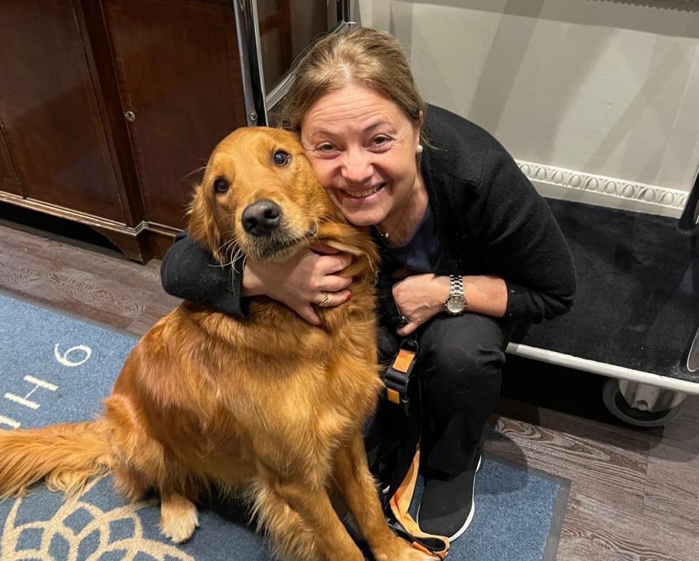 Our Head of Housekeeping Lourdes with one of our dog guests.