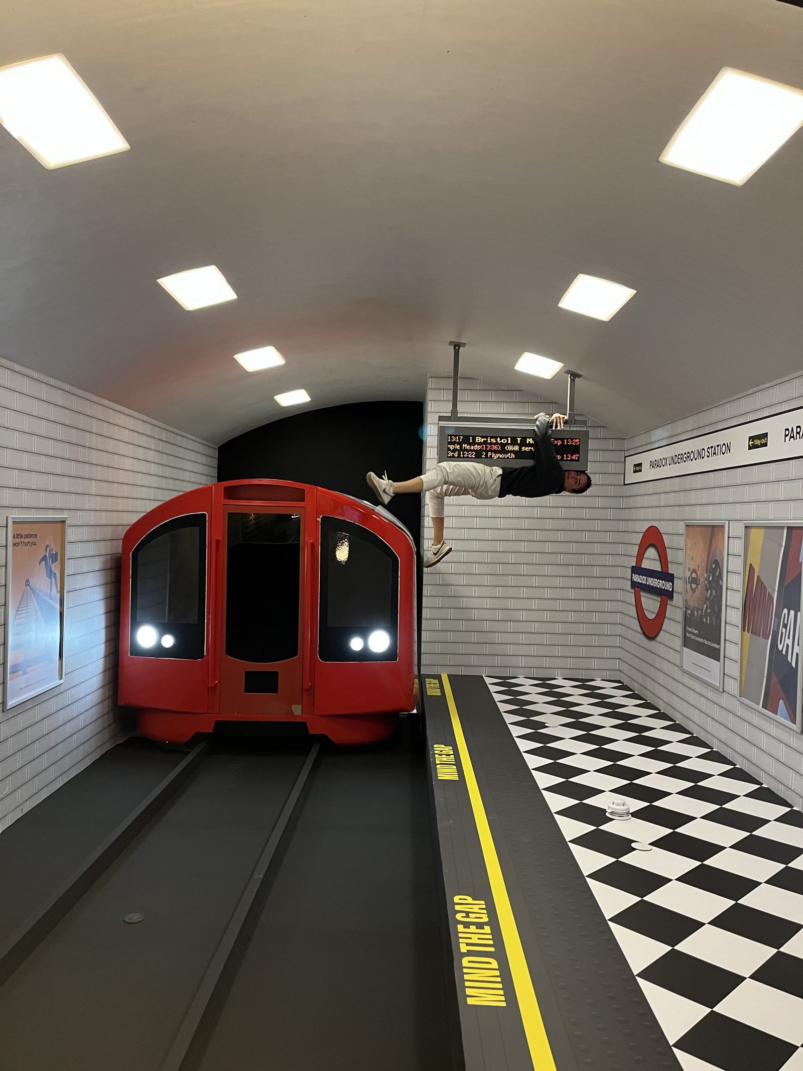 An upside down tube station in The Reverse Room at The Paradox Museum London.