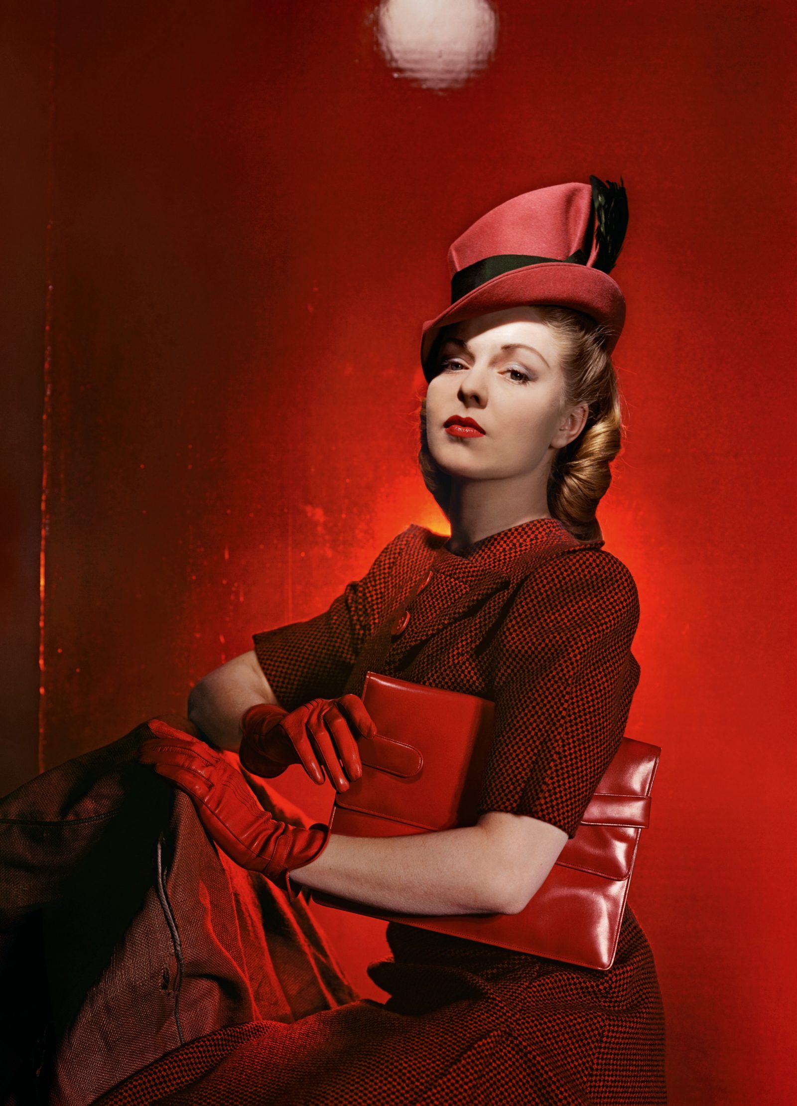 Cecil Beaton's photograph of a beautiful woman in red smart clothing and red accessories.