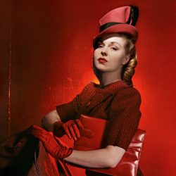 Cecil Beaton's photograph of a beautiful woman in red smart clothing and red accessories.