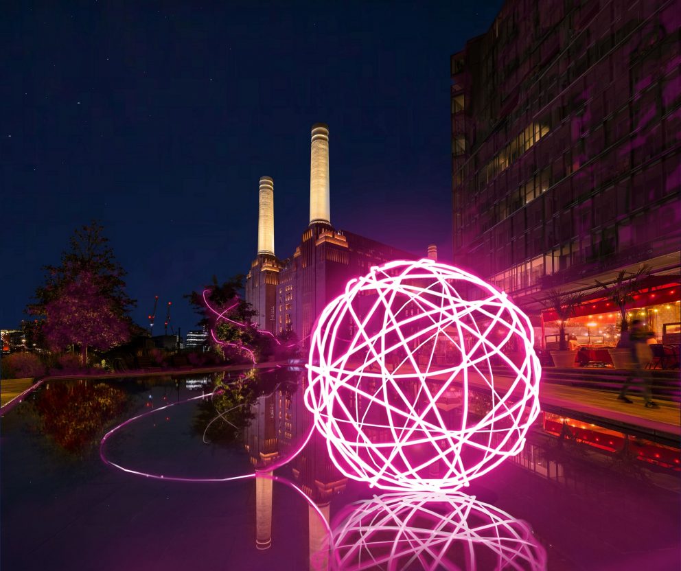 Spin Me a Yarn - a bright pink light installation representing a ball of wool, on display outside Battersea Power Station.