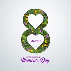 The silhouette of an 8 in flowers with a white background and the two centres of the figure of 8 cut out in white hearts. March is capitalised in purple in the lower heart, and International Women's Day is printed in purple below the 8.